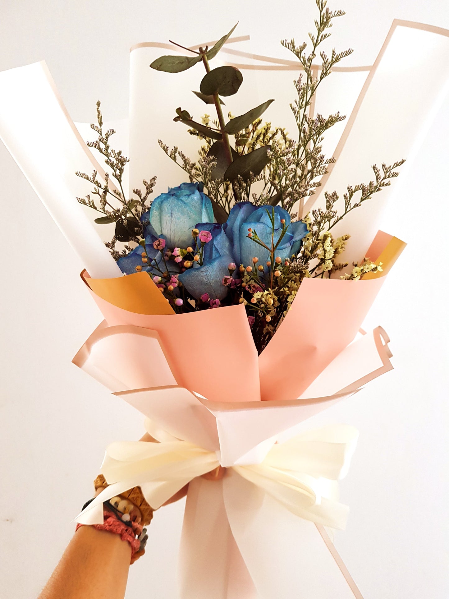 Oceana - A Bundle of 5 Blue Roses Along With Eucalyptus.