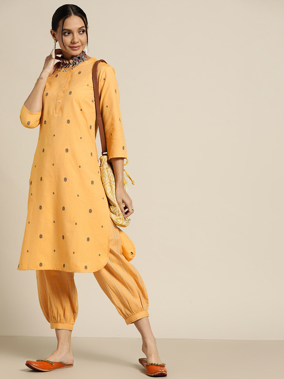 Women Yellow & Black Woven Design Regular Kurta with Salwar